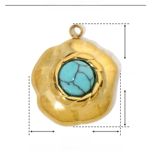 Detailed view of turquoise stone pendant in gold stainless steel with 17x15mm dimensions