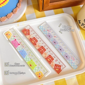 Detailed view of three 15cm cartoon acrylic rulers featuring bear and monster designs