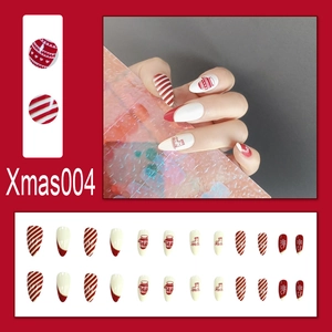 Detailed view of 24pcs Christmas press-on nails featuring snowflakes and Santa patterns
