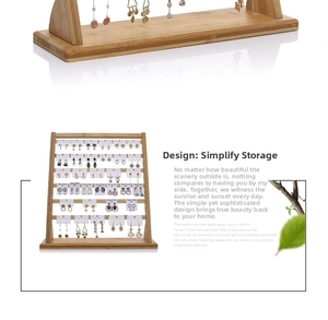 Detail view of tiered bamboo earring display stand showing high capacity card holders