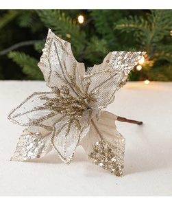 Detail of champagne gold Christmas flower with glitter mesh petals and festive textures