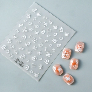 5D embossed waterproof nail art stickers featuring white flowers and butterfly patterns