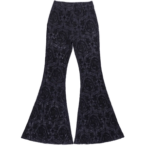Detail of gothic floral and portrait print on black high waisted flare trousers