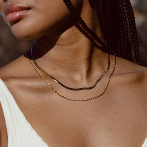 Layered gold stainless steel snake and twist chain necklace with geometric pendant for women