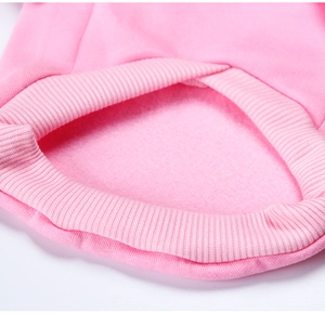 Close-up of pink dog hoodie showing warm fleece lining and ribbed elastic cuffs