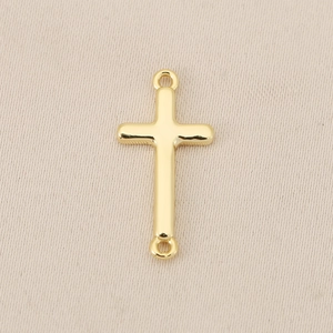 Detail of 18K gold-plated copper cross charm with dual loops for DIY jewelry making