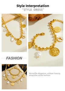 Detailed macro of gold beaded necklace set with religious coin charms and baroque pearls