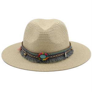 Close-up of bohemian straw fedora hat featuring colorful beads and turquoise stone