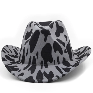 Close-up of thick cow print cowboy hat showing premium felt texture and fine stitching