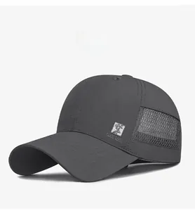 Close-up of breathable mesh side panels and buck deer patch on dark grey baseball cap
