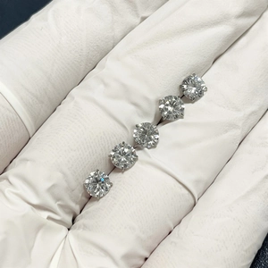 G23 Titanium flat back earrings with round cubic zirconia in five sizes on white glove