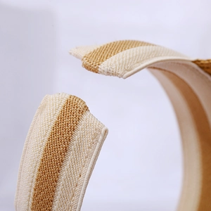 Detailed macro shot of the textured woven straw and fine stitching of the sun visor