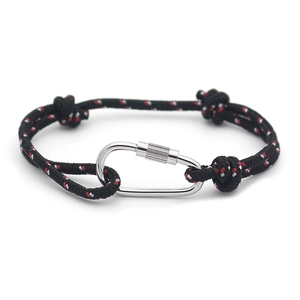 Detail of multi-color braided rope bracelet with a silver carabiner and sliding knot