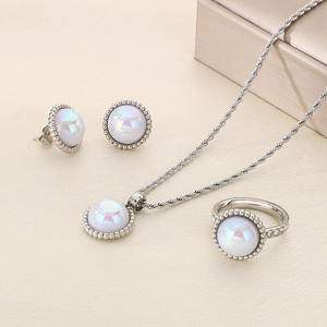 Detailed set of silver necklace, earrings and ring with iridescent shell inlay