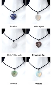 Detail view of heart-shaped gemstone necklaces in sodalite, agate, and opalite finishes