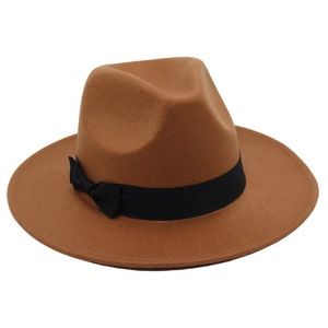 Detail view of camel wool fedora hat featuring a classic black ribbon and side bow
