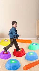 Detail of colorful balance stones with anti-slip texture and glowing leaf light for kids