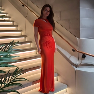 Elegant red slim fit maxi dress with short sleeves and cutout shoulder detail