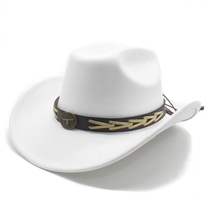 Detail of white cowboy hat featuring a leather band with an ornate bull head metal badge