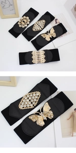 Detail showing elastic black waist belt with various gold rhinestone buckle designs