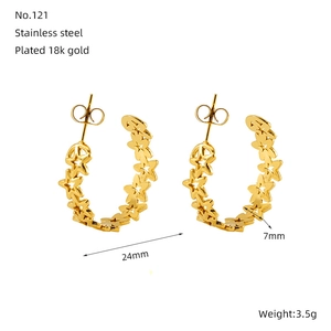 Detailed view of 18K gold-plated star earrings with 24mm diameter and 7mm width