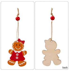 Front and back detail of a wooden gingerbread girl Christmas ornament with red polka dot dress