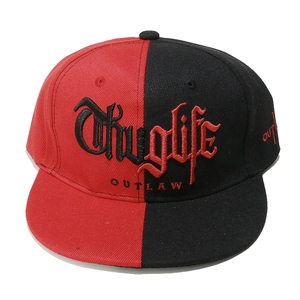 Close-up of Thuglife gothic embroidery on red and black flat brim hip hop cap