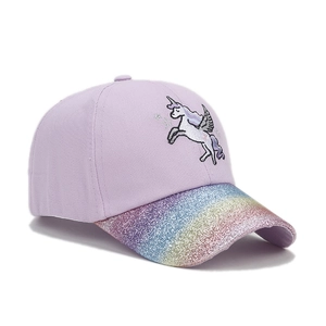 Detailed embroidery of unicorn on lilac baseball cap with rainbow glitter brim
