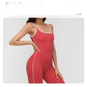 Detail of red yoga bodysuit featuring white contrast piping and high-elastic fabric