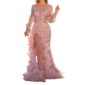 Detail of sequined embroidery and layered ruffle trim on the high slit pink evening gown