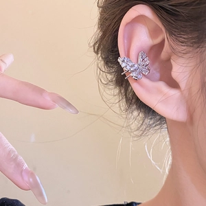 Elegant silver butterfly ear cuff with sparkling zircon crystals worn on ear