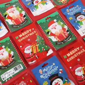 Christmas gift bags set featuring Santa, snowman, and reindeer in red and green colors