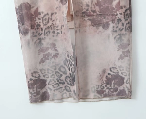 Close-up of lightweight mesh fabric with rose floral and leopard print patterns