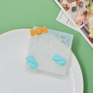 Silicone candy mold for fondant and chocolate shown with colorful marshmallow shapes