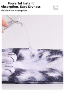 Close-up demonstration of high-absorbent microfiber towel with cat paw pattern texture
