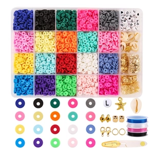 24-grid DIY jewelry kit with clay beads, letter charms and starfish pendants on white background