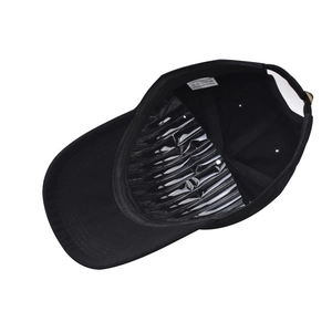 Detail view of cotton baseball cap interior with 100% cotton label and internal support