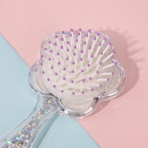 Floral shape clear hairbrush with holographic sequins and purple tipped bristles