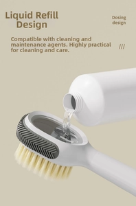 Detail of pouring cleaning liquid into the transparent dosing chamber of a white shoe brush