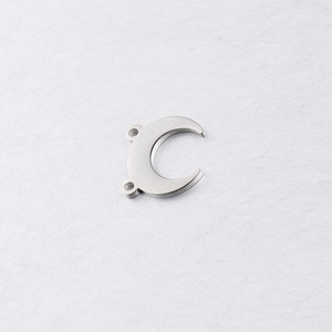 Macro shot of silver crescent moon horn charm for DIY jewelry in mirror polished finish
