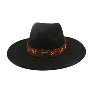 Detail of black western felt cowboy hat with bronze bull head buckle and brown band