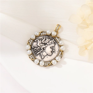 Macro detail of vintage Roman relief pendant with white pearls and sparkling rhinestones
