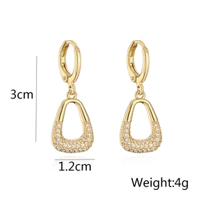 Detail view of gold hoop earrings with zircon trapezoid pendant and size dimensions