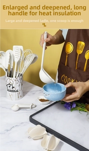Macro detail of an 11-piece white marble silicone kitchenware set with storage holder