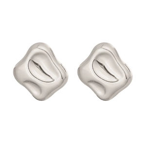 Macro view of silver organic irregular fluid square studs with high-polish metallic finish