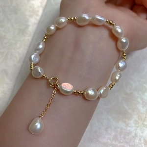 Detailed view of Baroque pearl bracelet with 14K gold-filled beads and extension chain
