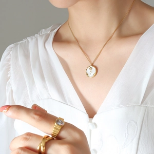 French style gold plated necklace with rose enamel pendant and rope rings on model