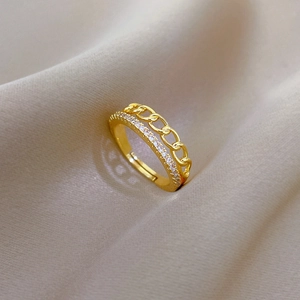 Detailed macro view of gold plated chain ring with sparkling micro-pave zircon crystals
