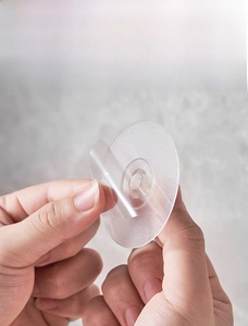 Strong transparent adhesive wall hook patch shown with peel-off protective film detail