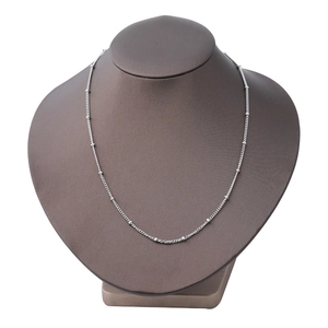 Polished 2mm silver stainless steel bead chain necklace displayed on a jewelry bust